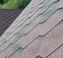 A Roof with Hexagonal Asphalt Shingles in Red and Black
